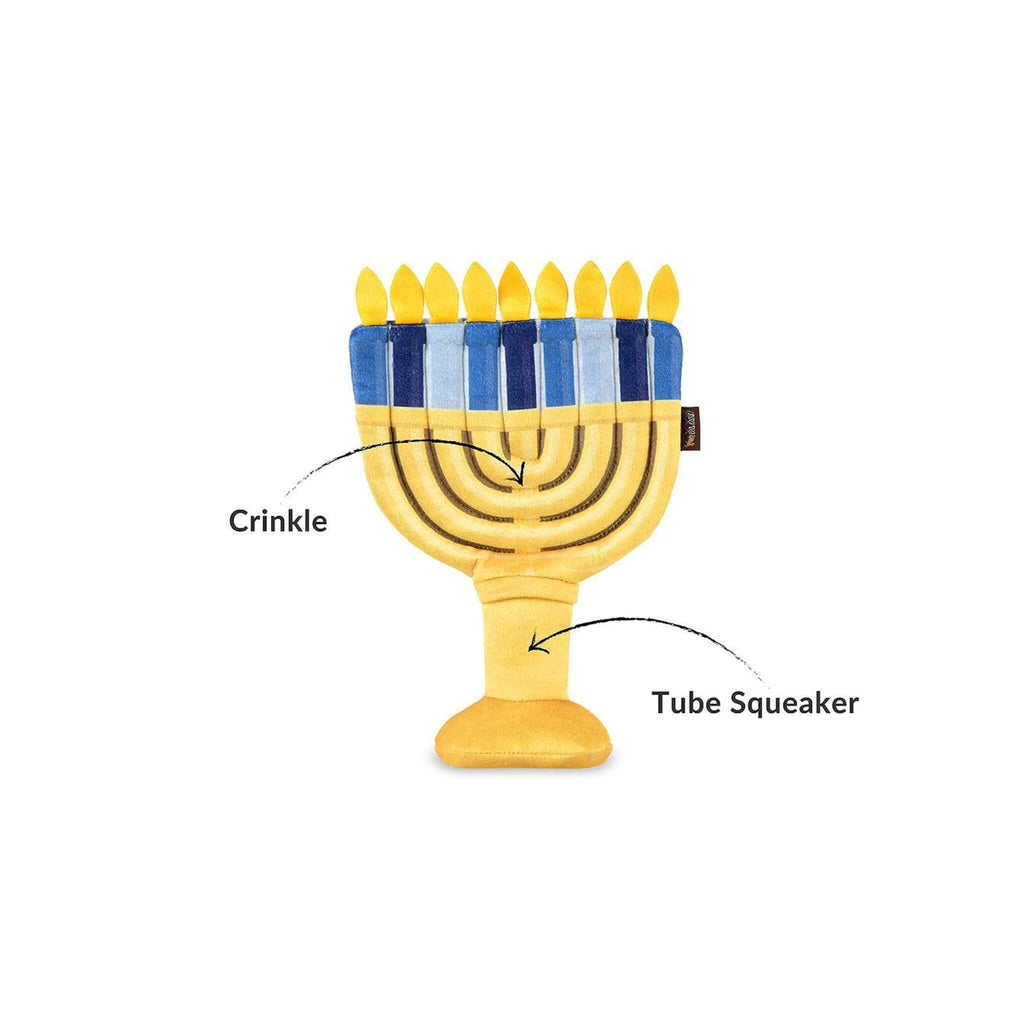 Menorah-shaped dog toy with crinkle and tube squeaker features on a white background