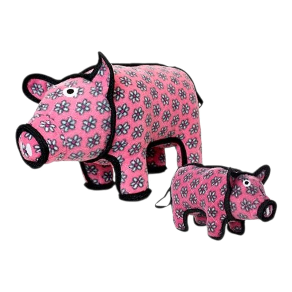 Two pink pig dog toys with black flower patterns on a white background