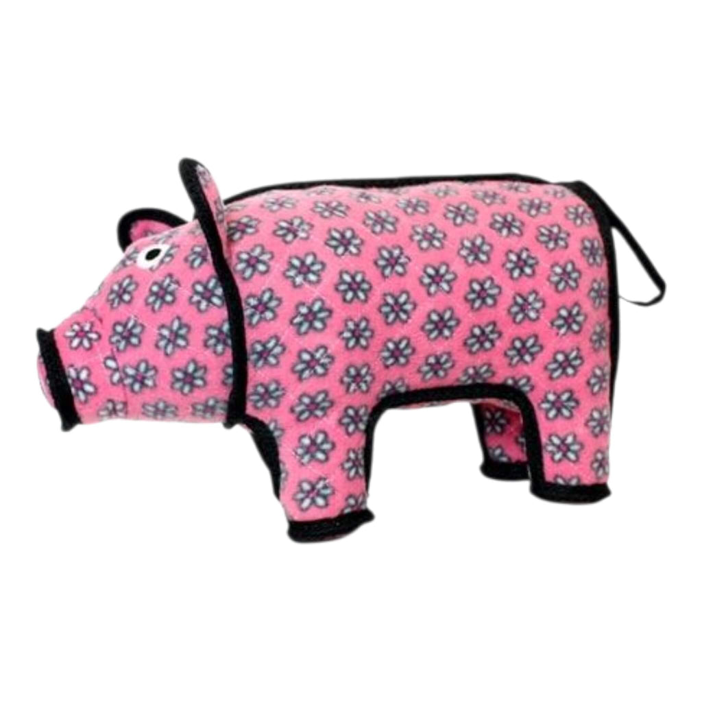 Pink pig dog toy with floral pattern on a white background