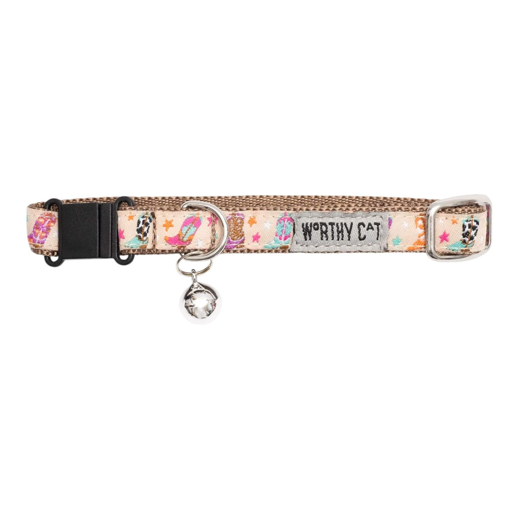 Dog collar with colorful pattern and 'Worthy Cat' branding on a white background