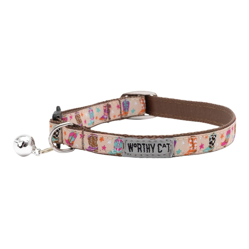 Cat collar with colorful pattern and 'Worthy Cat' branding on a white background