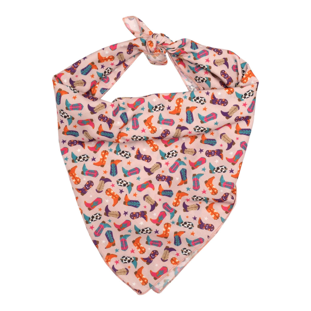 Colorful dog bandana with a western-themed pattern on a white background