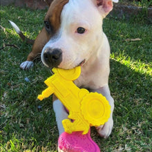 Load image into Gallery viewer, Pittie enjoys chewing his Industrial Tractor Dog Chew Toy

